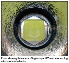 Photo showing flat surface of high-output LED and surrounding  micro-textured reflector.